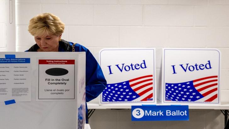 Voter in US election polling booth Arlington Virginia